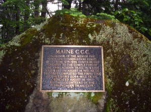 A plaque on a large rock along the trail recognizing the final constructed section of trail to make it a complete pathway